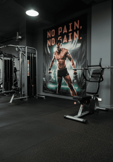 Image 3: realistic image of a gym with a motivational banner